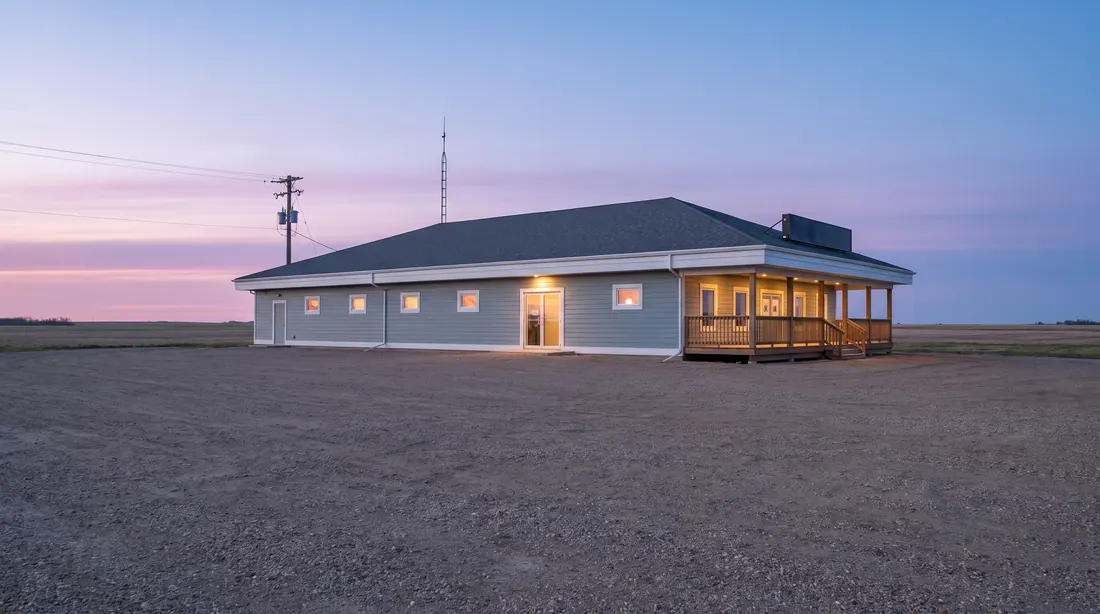 Kiinu Oasis Gaming Centre on the prairie at dusk